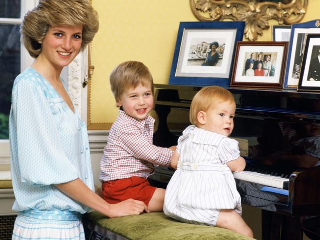 Diana, Princess of Wales with her sons, Prince William and Prince Harry, at the piano in Kensington Palace Picture: Getty Images