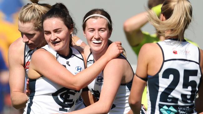 Keeley Skepper (centre) celebrates after booting one of her three goals against West Coast in round 3. Picture: Will Russell / Getty Images