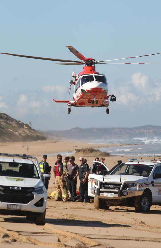 An air ambulance lands at the scene of a helicopter crash in the shallows between Ocean Grove and Point Lonsdale. Picture: Alan Barber
