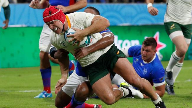 South Africa's number 8 Schalk Brits (L) scores a try during the Japan 2019 Rugby World Cup Pool B match between South Africa and Namibia at the City of Toyota Stadium in Toyota City on September 28, 2019. (Photo by Adrian DENNIS / AFP)