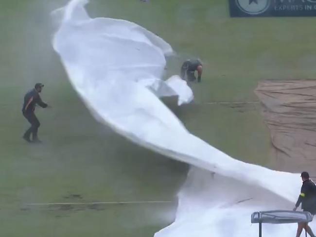 Wild weather at the WACA as groundsman gets wiped out.