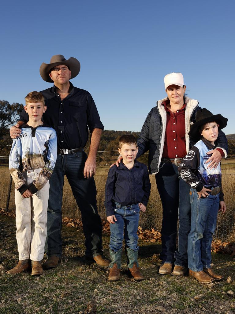 Troy and Elise Robinson with their sons Noah, 10, Nash, 8, and Chad, 4, on their farm at Bendemeer. Picture: Jonathan Ng