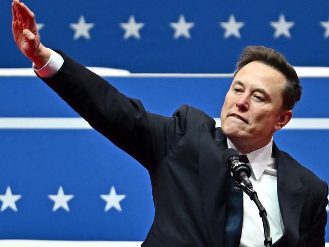 Tesla and SpaceX CEO Elon Musk gestures as he speaks during the inaugural parade inside Capitol One Arena, in Washington, DC, on January 20, 2025. (Photo by ANGELA WEISS / AFP)