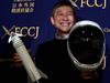 (FILES) This file photo taken on October 9, 2018 shows Yusaku Maezawa, entrepreneur and then-chief of online fashion company Zozo and SpaceX BFR's first private passenger, poses with a miniature rocket and space helmet prior to start of a press conference at the Foreign Correspondents' Club of Japan in Tokyo. - A Japanese billionaire has launched an online wanted ad -- a girlfriend who will fly around the Moon with him on a SpaceX rocket. The deadline to apply is January 17, 2020. (Photo by Toshifumi KITAMURA / AFP)