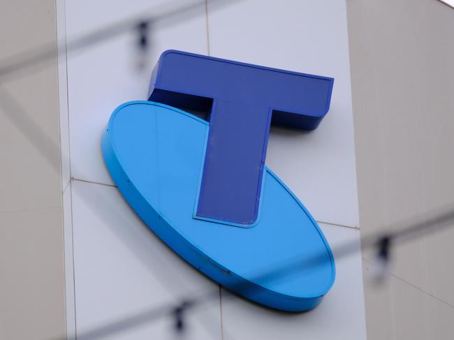 MELBOURNE, AUSTRALIA - NewsWire Photos OCTOBER 4, 2022. Generic photo people walking past the Telstra logo in Melbourne..Picture: NCA NewsWire / Luis Enrique Ascui