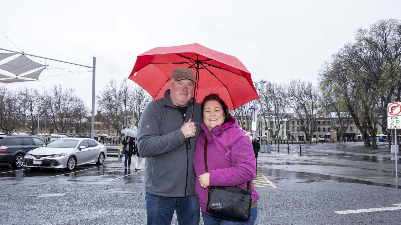 Tasmania Wet Weather - Shane and Cynthia Taylor at Salamanca. Picture: Caroline Tan