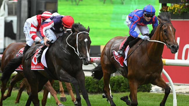 Air Assault (red cap) finishing second behind Globe in the Cranbourne Cup last start. Picture: Vince Caligiuri/Getty Images