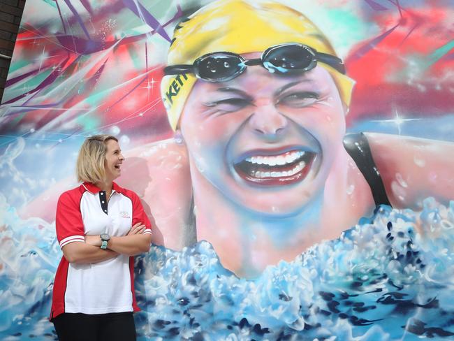 Former Olympian and long time Brisbane local Libby Trickett with a newly painted mural of herself, at The Valley Pool, where she started swimming. Picture: Jono Searle.