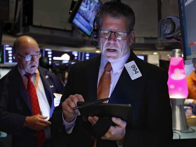 FILE - In this Sept. 13, 2019, file photo trader Sean Spain works on the floor of the New York Stock Exchange. The U.S. stock market opens at 9:30 a.m. EDT on Wednesday, Sept. 18. (AP Photo/Richard Drew, File)