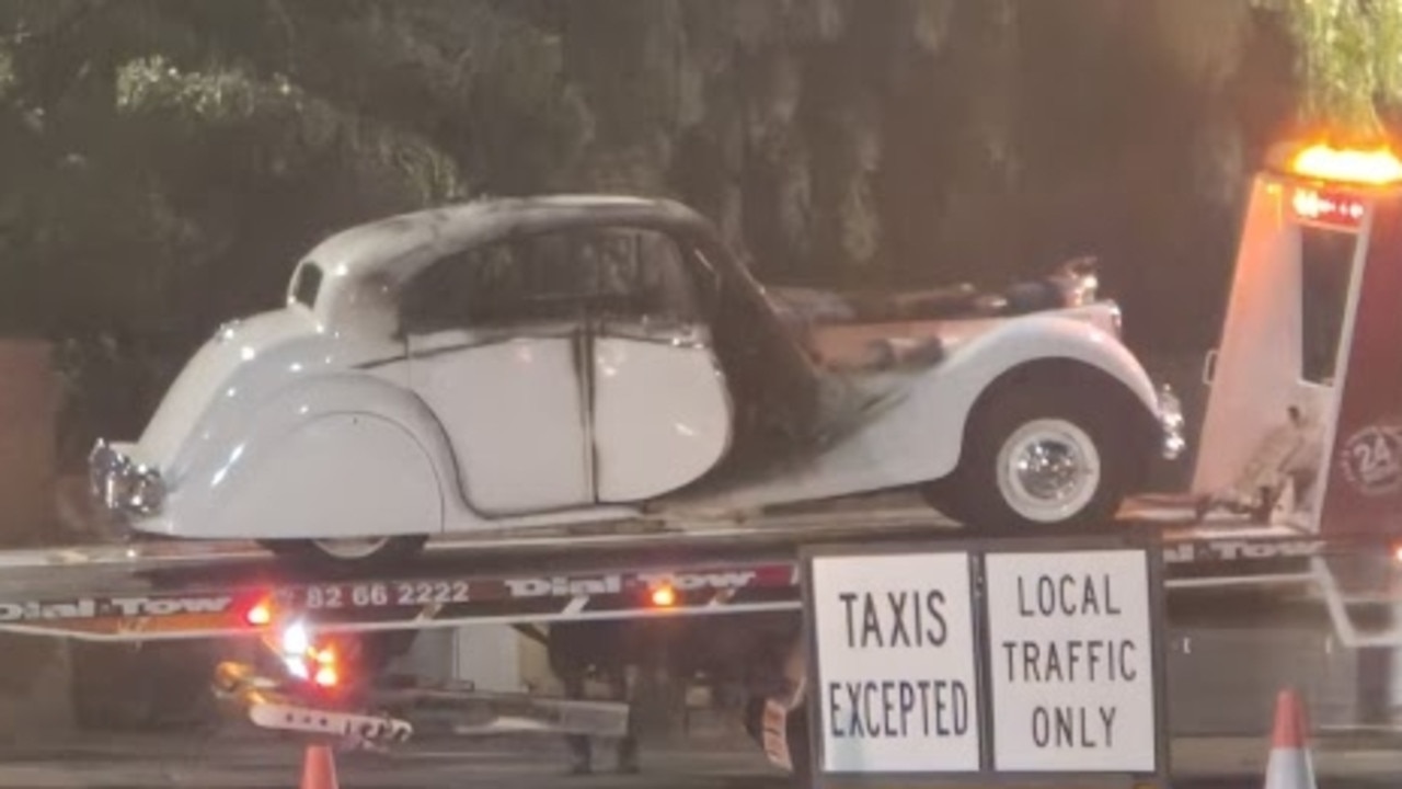 A vintage Jaguar caught fire in Adelaide’s CBD on Saturday. Picture: Jessica Ball