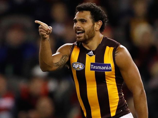 MELBOURNE, AUSTRALIA - JUNE 10: Cyril Rioli of the Hawks celebrates a goal during the 2016 AFL Round 12 match between the Essendon Bombers and the Hawthorn Hawks at Etihad Stadium on June 10, 2016 in Melbourne, Australia. (Photo by Adam Trafford/AFL Media/Getty Images)