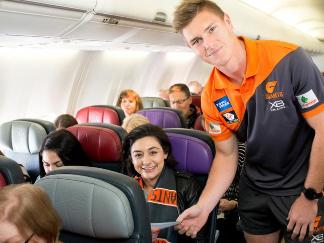 GWS Giants players on Virgin flight this morning giving away free tickets to next week's preliminary final at the MCG.