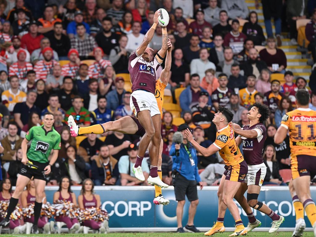 Jason Saab of the Sea Eagles flies high to catch a Cherry-Evans kicks. Picture: Bradley Kanaris/Getty Images