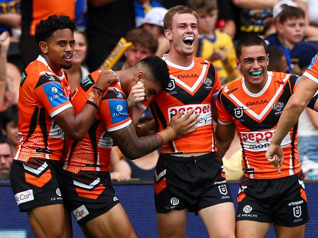 The Tigers celebrate a miraculous try to Lachlan Galvin.