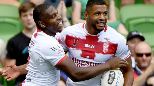 Jermaine McGillvary celebrates a try for England.