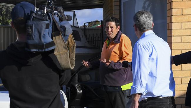 The father of the man charged with murder speaks to media outside his house in Salisbury Downs. Picture: Mark Brake