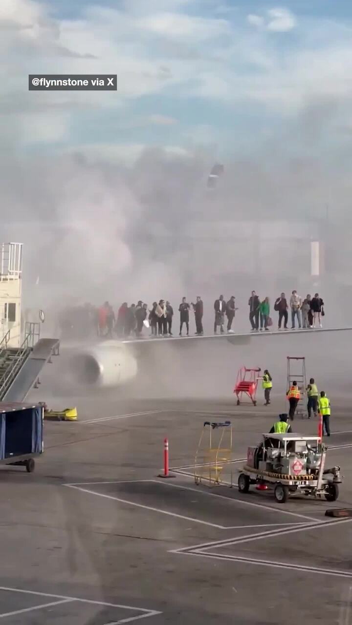 Passengers evacuated as plane catches fire