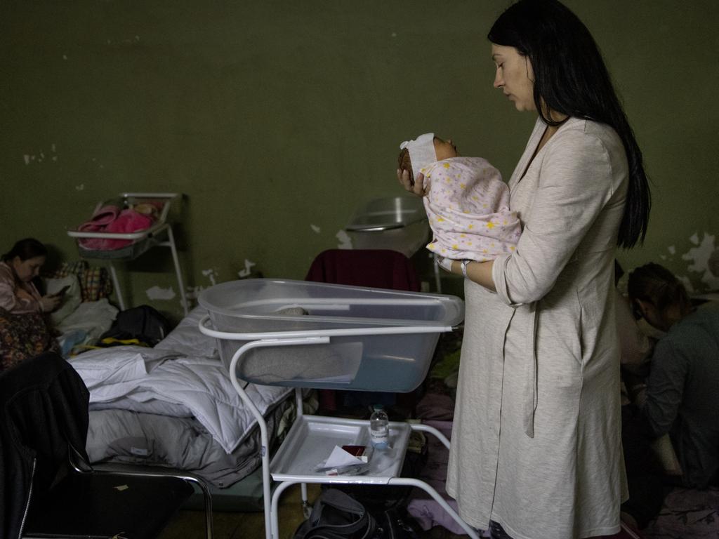 A mother holds her newborn baby in the bomb shelter of a maternity hospital in Kyiv, Ukraine. Picture: Getty Images