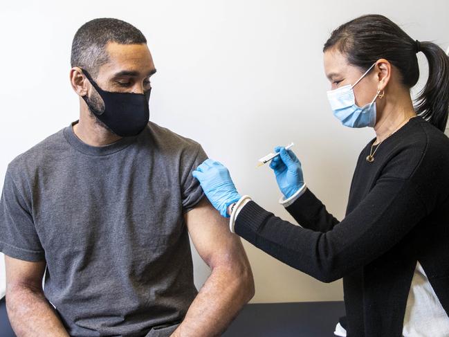 Dr. Adrienne Chan administers an AstraZeneca vaccination. Picture: Aaron Francis/The Australian