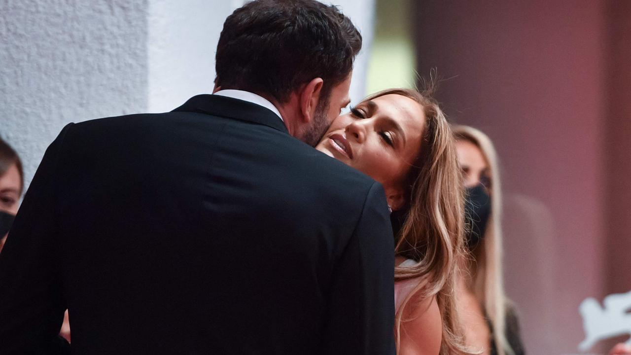 Canoodling on the red carpet. Picture: Filippo Monteforte/AFP