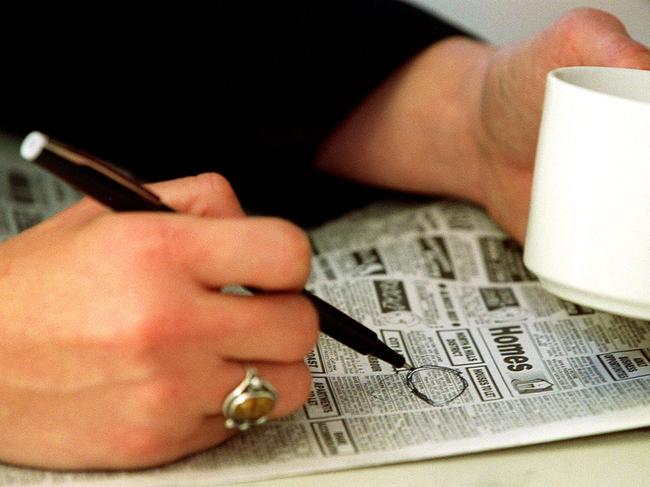 Generic photo featuring Renee Nowytarger scanning the Tele classifieds section of a newspaper with pen in her hand. People. Situation. Job advertisement. Ad. Job ads. Employment. Job hunting.