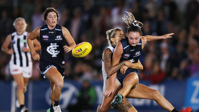 MELBOURNE, AUSTRALIA - FEBRUARY 02:  Nicola Stevens of the Blues gets tackled by Moana Hope of the Magpies during the round one AFLW match between the Carlton Blues and the Collingwood Magpies at Ikon Park on February 2, 2018 in Melbourne, Australia.  (Photo by Michael Dodge/Getty Images)