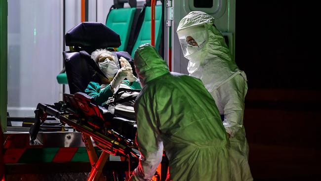 An elderly patient allegedly infected with COVID-19 is taken from a nursing home by ambulance in Buenos Aires, Argentina. Many countries have made the mistake of closing schools to protect low-risk children and teachers while neglecting the protection of those at high risk, especially in nursing homes. Picture: AFP