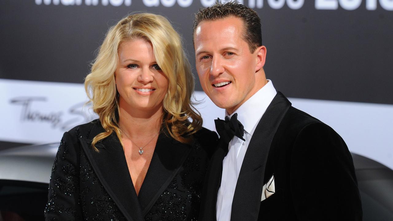 Formula 1 driver Michael Schumacher and his wife Corinna in 2010. AFP PHOTO / JENS KALAENE