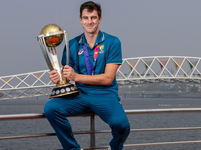 AHMEDABAD, INDIA - NOVEMBER 20:  Australia Captain Pat Cummins poses with the ICC Men's Cricket World Cup Trophy near the Atal Bridge on the Sabarmati Riverfront on November 20, 2023 in Ahmedabad, India. Australia won their sixth ICC Men's Cricket World  Cup defeating India in the final yesterday. (Photo by Darrian Traynor-ICC/ICC via Getty Images) ** NOT FOR COMMERCIAL USE**