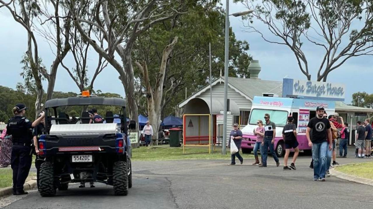 Police investigate an incident in which a tractor came loose and rolled across the road an into another vehicle during the Toowoomba Royal Show on Saturday.