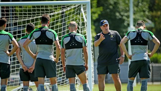 Socceroos training at Olympic Park, Coach Ange Postecoglou talks with the players. Melbourne. 3rd January 2015. Picture: Colleen Petch.