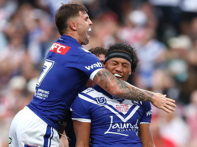 SYDNEY, AUSTRALIA - MARCH 08: Sitili Tupouniua of the Bulldogs celebrates with team mate Toby Sexton of the Bulldogs after scoring a try during the round one NRL match between St George Illawarra Dragons and Canterbury Bulldogs at Netstrata Jubilee Stadium, on March 08, 2025, in Sydney, Australia. (Photo by Mark Metcalfe/Getty Images)