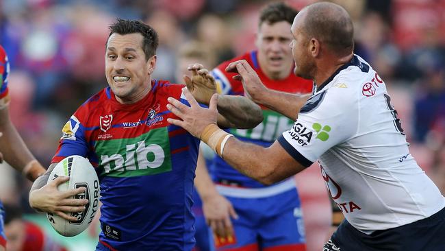 Mitchell Pearce runs the ball past Matt Scott last weekend. Picture: AAP/Darren Pateman