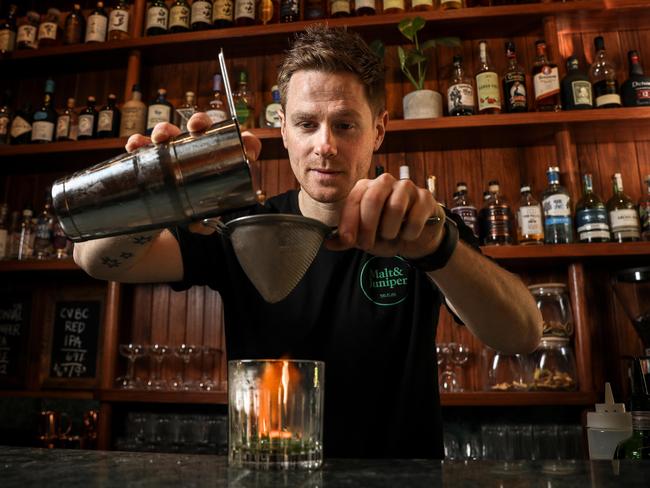 SourceSA feature on new bars in Adelaide - Malt & Juniper has just been nominated for a design award -  Managing Partner Matt Holding makes a "Herb Harvest' flaming drink, Tuesday September 4, 2018 - pic AAP/MIKE BURTON