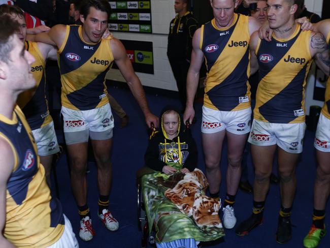 Nate Anderson joins in the club song after the Tigers win in Round 15. Pic: Michael Klein.