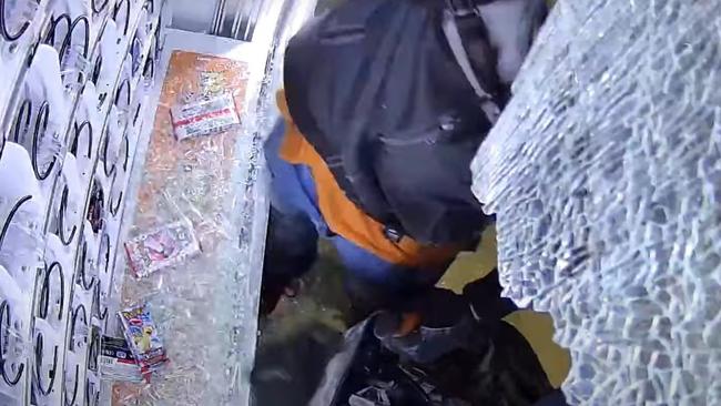 A Pokemon card vending machine in Salisbury Downs was broken into with a mallet by two suspects who took packs of the cards in a duffel bag. Picture: SAPOL