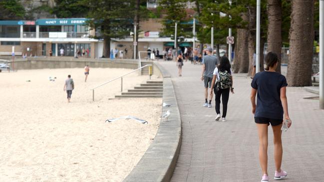 People can exercise on the sand on the closed beaches, but cannot swim, sit down or sunbake. Picture: Jeremy Piper