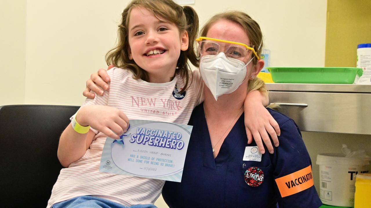 Registered nurse Emma Davenport with Kiarah Hooker-Bretones, 10, who just got her second dose. Picture: Julian Cunningham / SA HEALTH