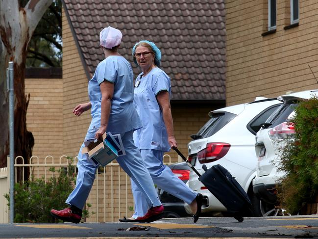 A worker at Dorothy Henderson Lodge in Macquarie Park, part of the Baptist Care Aged Care facility has tested positive to the Coronavirus and is now in isolation at North Shore hospital. Medical workers on the scene. Picture: Toby Zerna