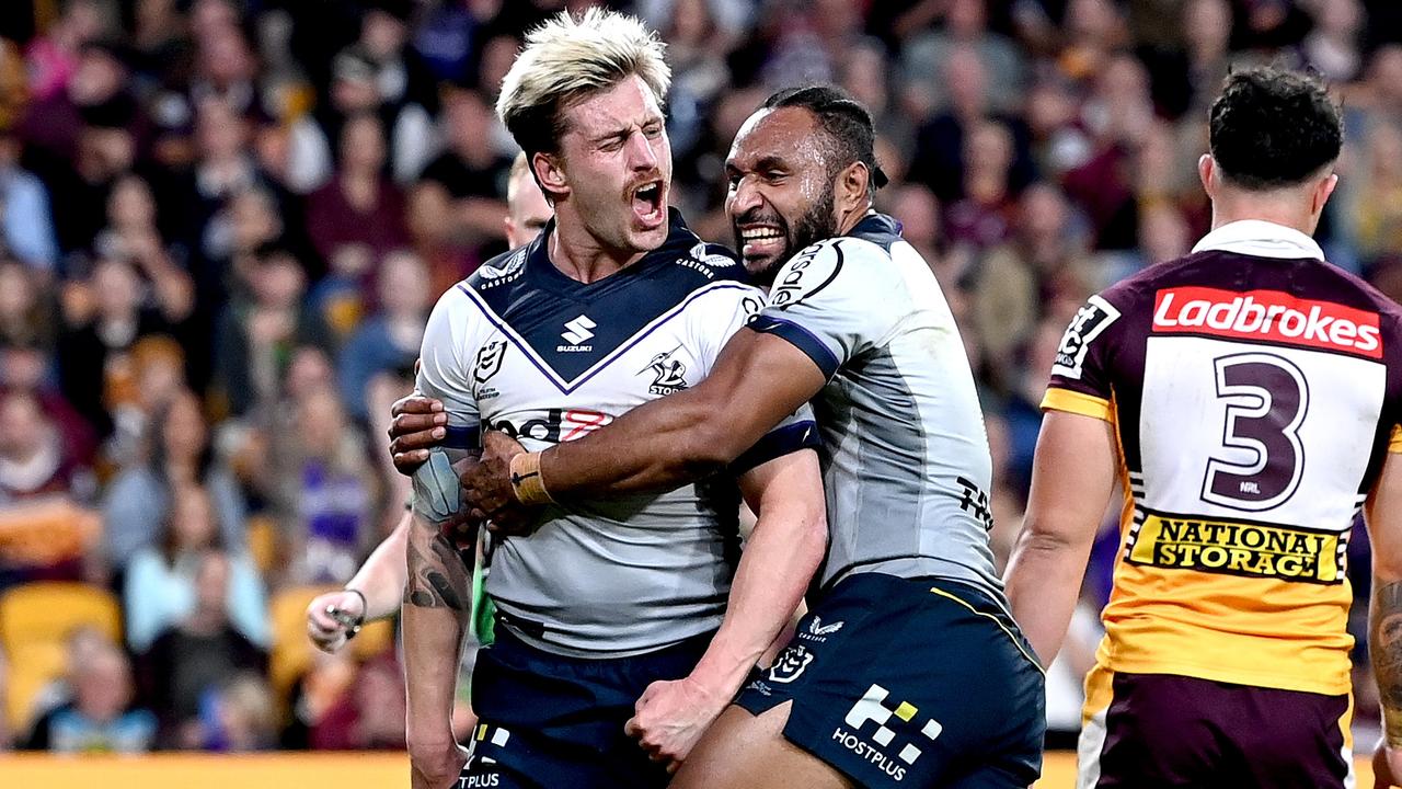 BRISBANE, AUSTRALIA - AUGUST 19: Cameron Munster of the Storm celebrates scoring a try during the round 23 NRL match between the Brisbane Broncos and the Melbourne Storm at Suncorp Stadium, on August 19, 2022, in Brisbane, Australia. (Photo by Bradley Kanaris/Getty Images)