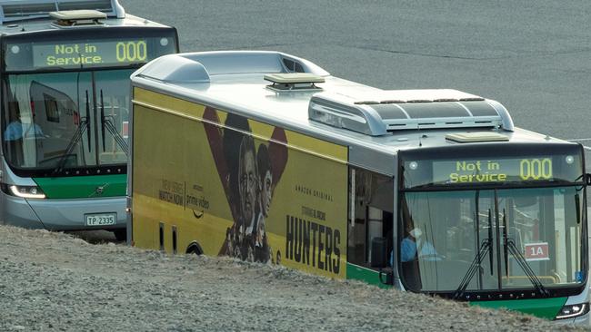 Passengers from Artania are transferred with a police escort to Perth International Airport to be transported to Germany on Sunday. Picture: AFP.