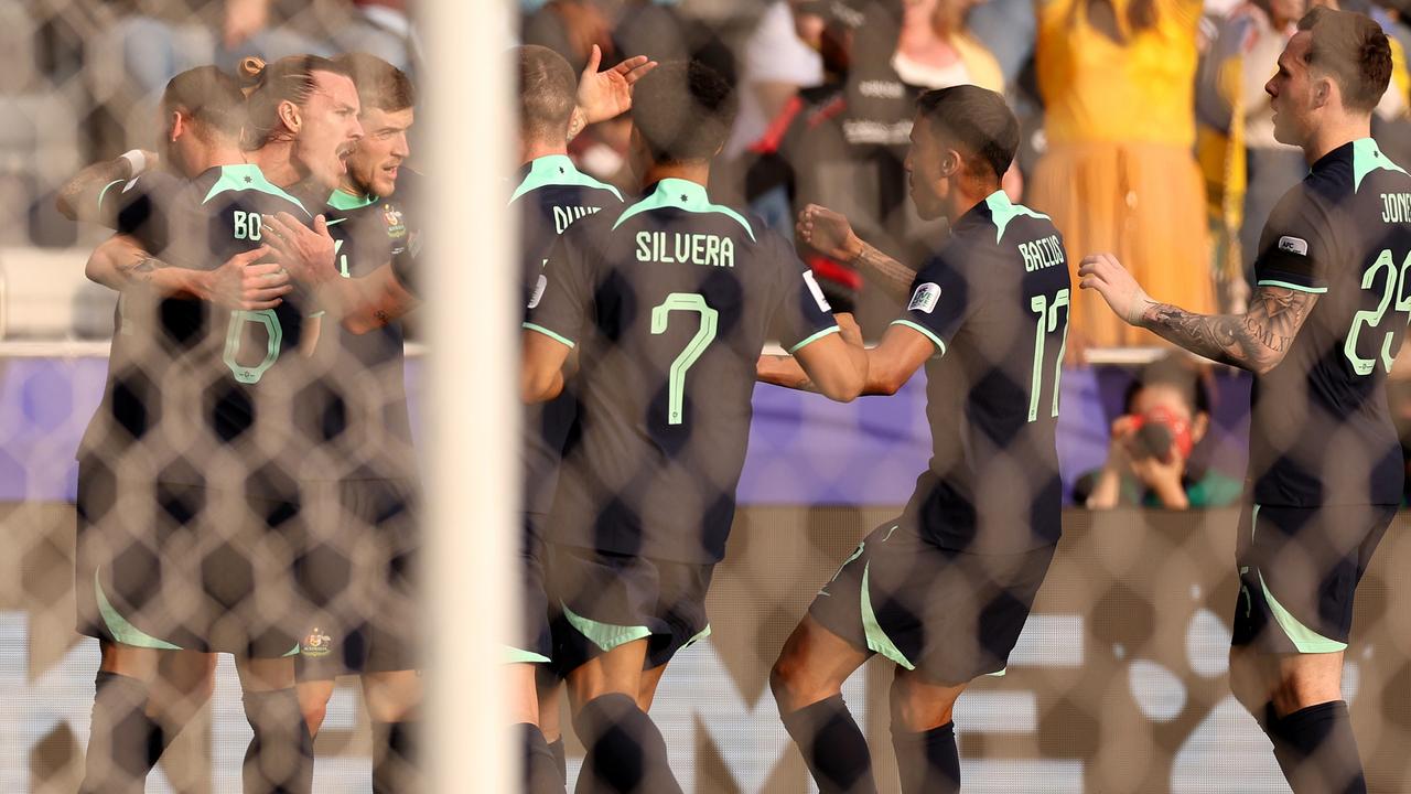 DOHA, QATAR - JANUARY 18: Jackson Irvine of Australia celebrates with team mates scoring his team's first goal during the AFC Asian Cup Group B match between Syria and Australia at Jassim Bin Hamad Stadium on January 18, 2024 in Doha, Qatar. (Photo by Robert Cianflone/Getty Images)