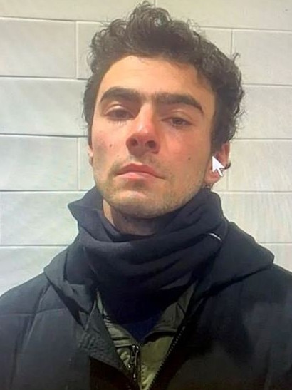 Luigi Mangione, 26, in a police mugshot taken Monday, hours after his arrest at a Pennsylvania McDonald's