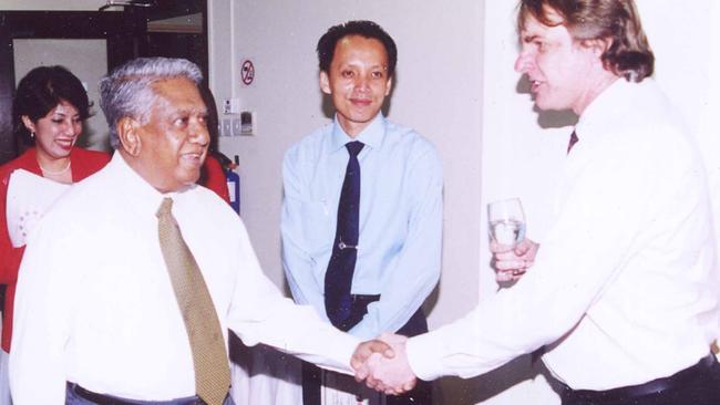 Dr John Tholen, right, with former Singaporean President S. R. Nathan.