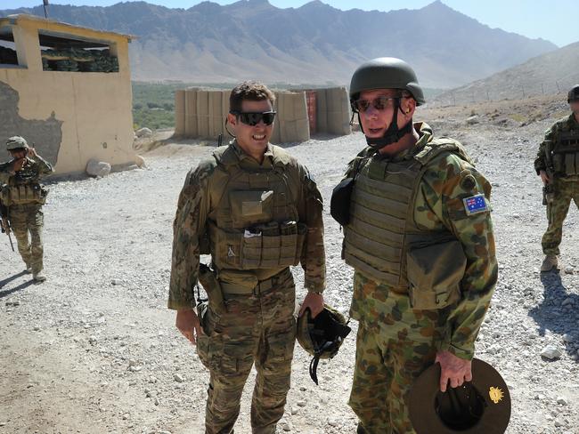 General David Hurley AC, DSC and Chief of the Defence Force (2nd R) is welcomed by Australian soldier Captain Alastair Robinson to Patrol Base Mirwais in Afghanistan.