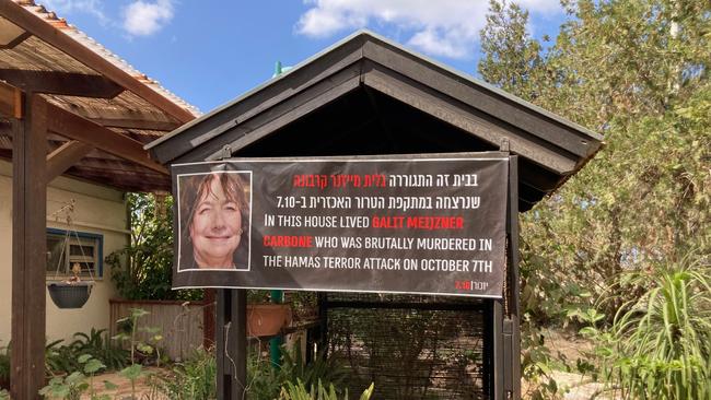 Be’eri Kibbutz, where more than 100 people, including Australian grandmother Galit Carbone pictured on a banner, were murdered by Hamas terrorists on October 7. Picture: Geoff Chambers