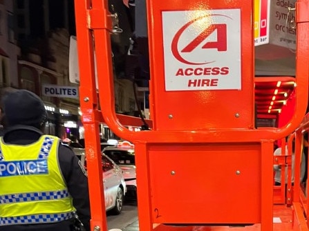 Police have arrested a man after he was caught driving a stolen scissor lift down Hindley St on Sunday morning. Picture: SAPOL