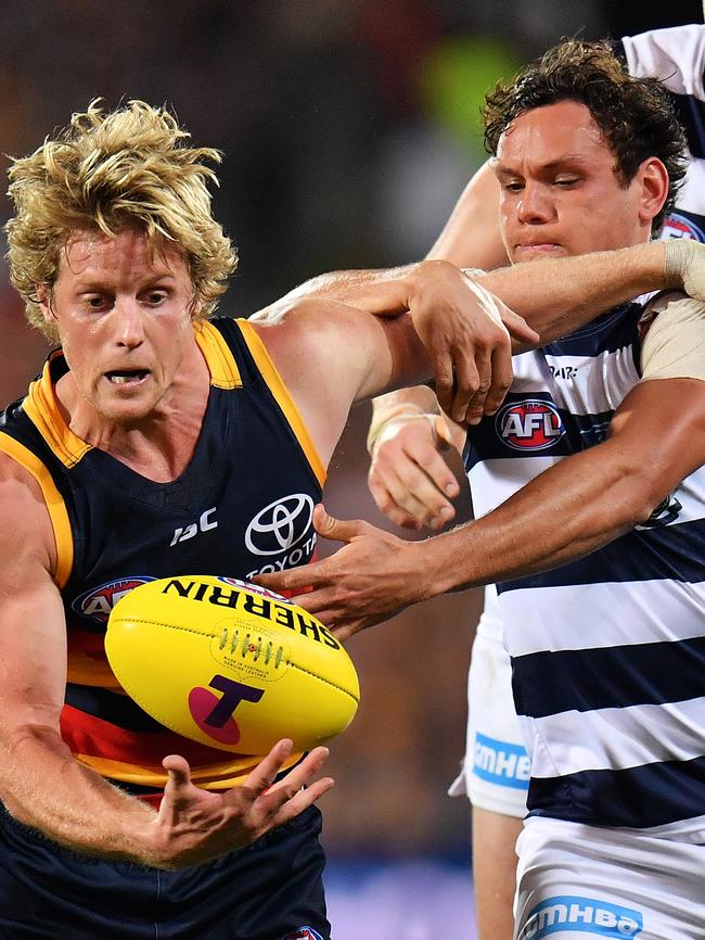 Steven Motlop attempts to tackle Crows star Rory Sloane. Picture: Daniel Kalisz/Getty Images