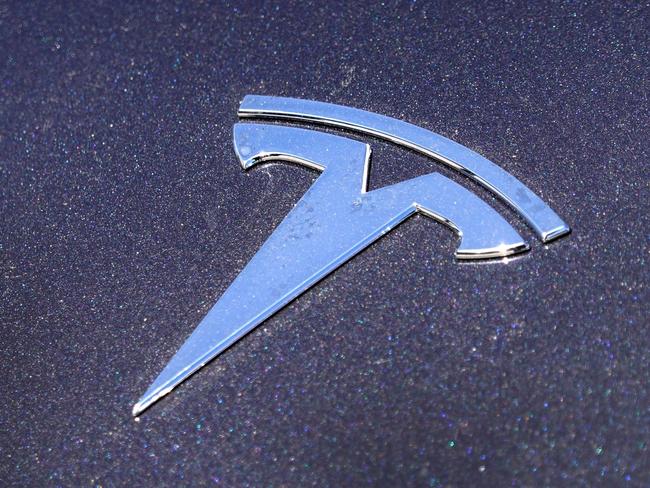 CHICAGO, ILLINOIS - MARCH 28: A hood ornament is shown on a Tesla car parked in a dealership lot on March 28, 2022 in Chicago, Illinois. Shares of Tesla jumped more than 8 percent today after the electric car maker announced a second stock split in less than two years.   Scott Olson/Getty Images/AFP == FOR NEWSPAPERS, INTERNET, TELCOS & TELEVISION USE ONLY ==