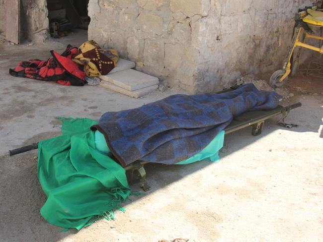 A covered body lies outside a hospital in Khan Sheikhun following the horrifying incident. Picture: Omar haj Kadour/AFP